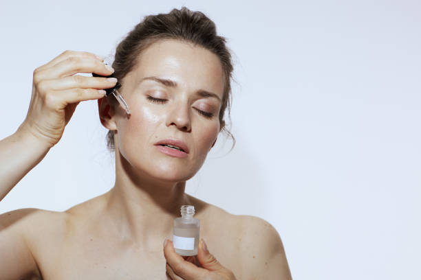 Woman applying facial serum for skincare routine